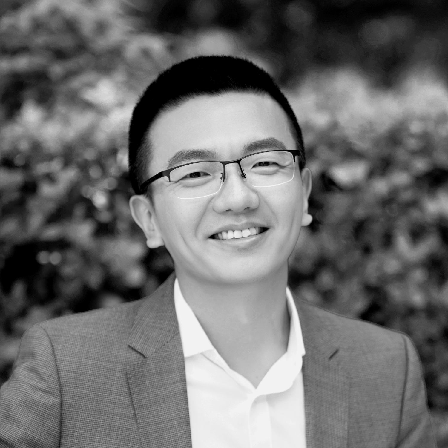 Black and white formal headshot of Zhan Yang.
