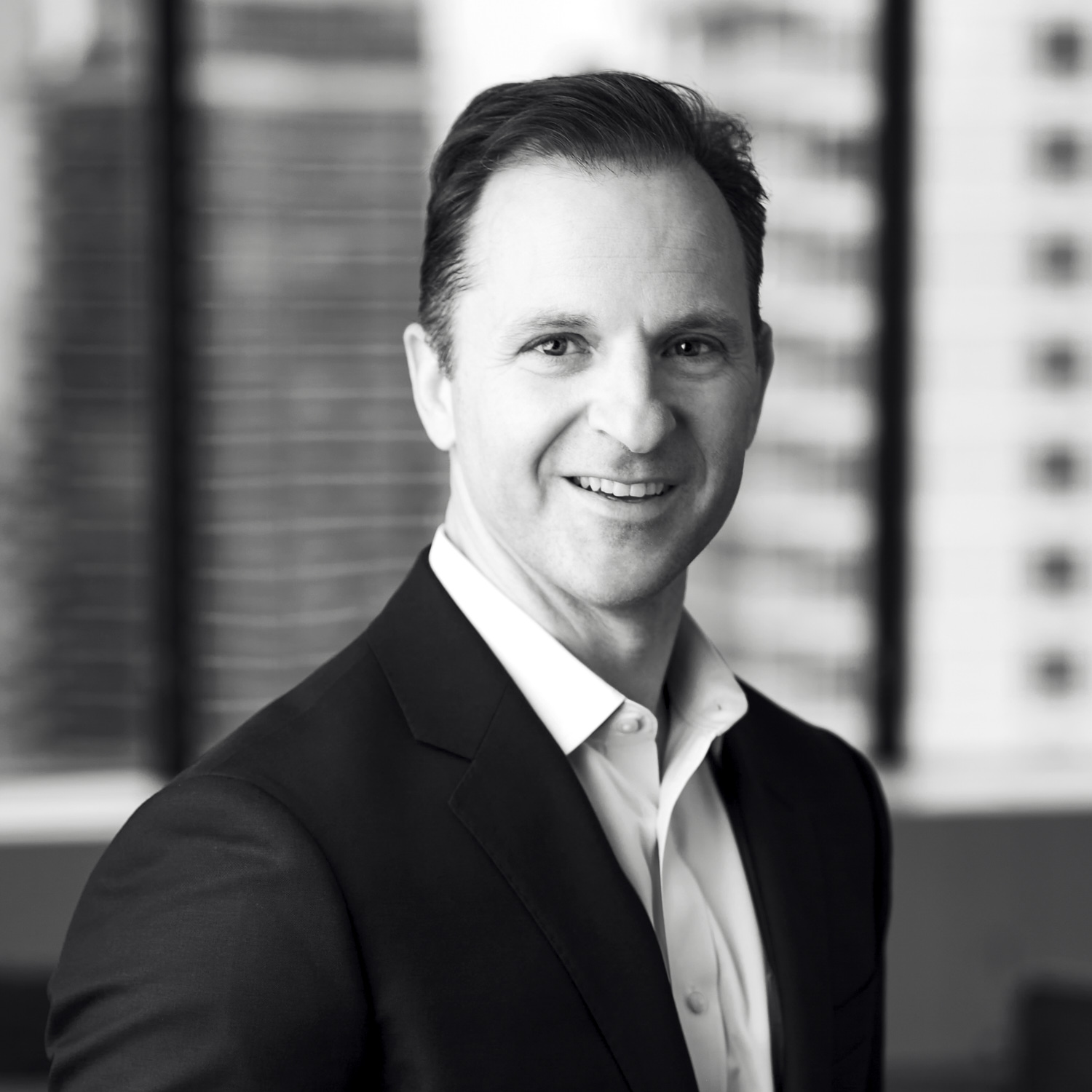 Black and white formal headshot of Paul Lanna.