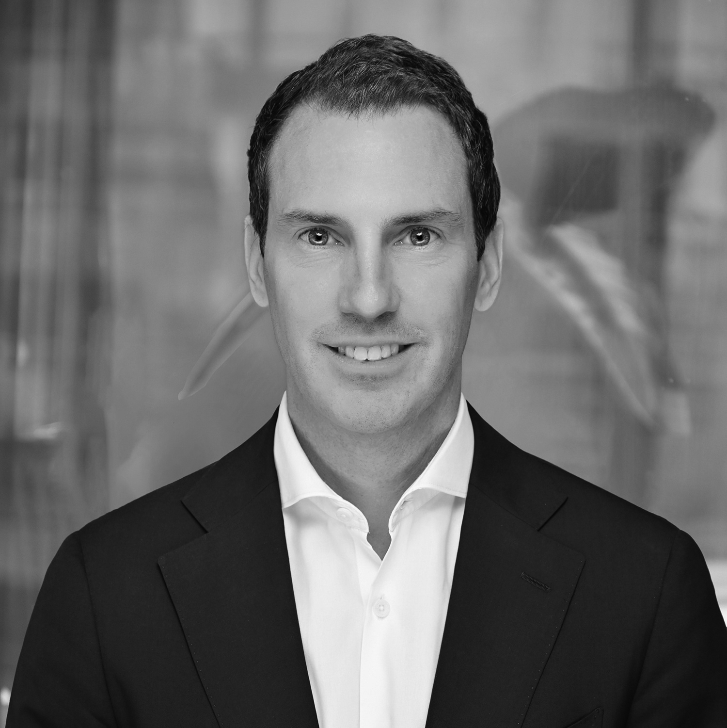 Black and white formal headshot of Jonathan McEvoy