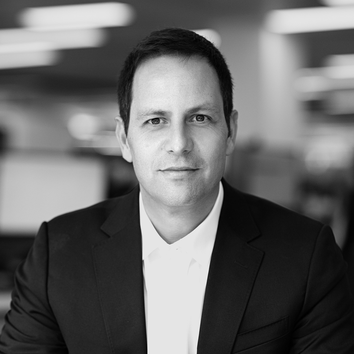 Black and white formal headshot of Yonatan Puterman