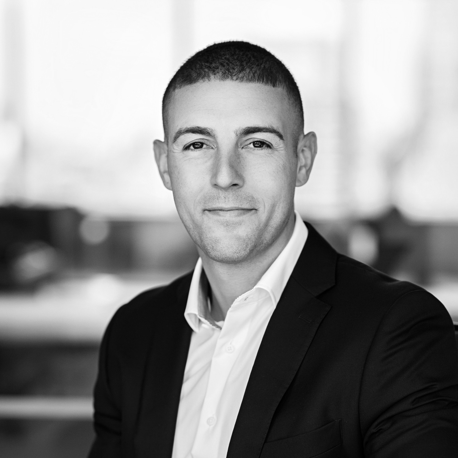 Black and white formal headshot of Mike Acri.