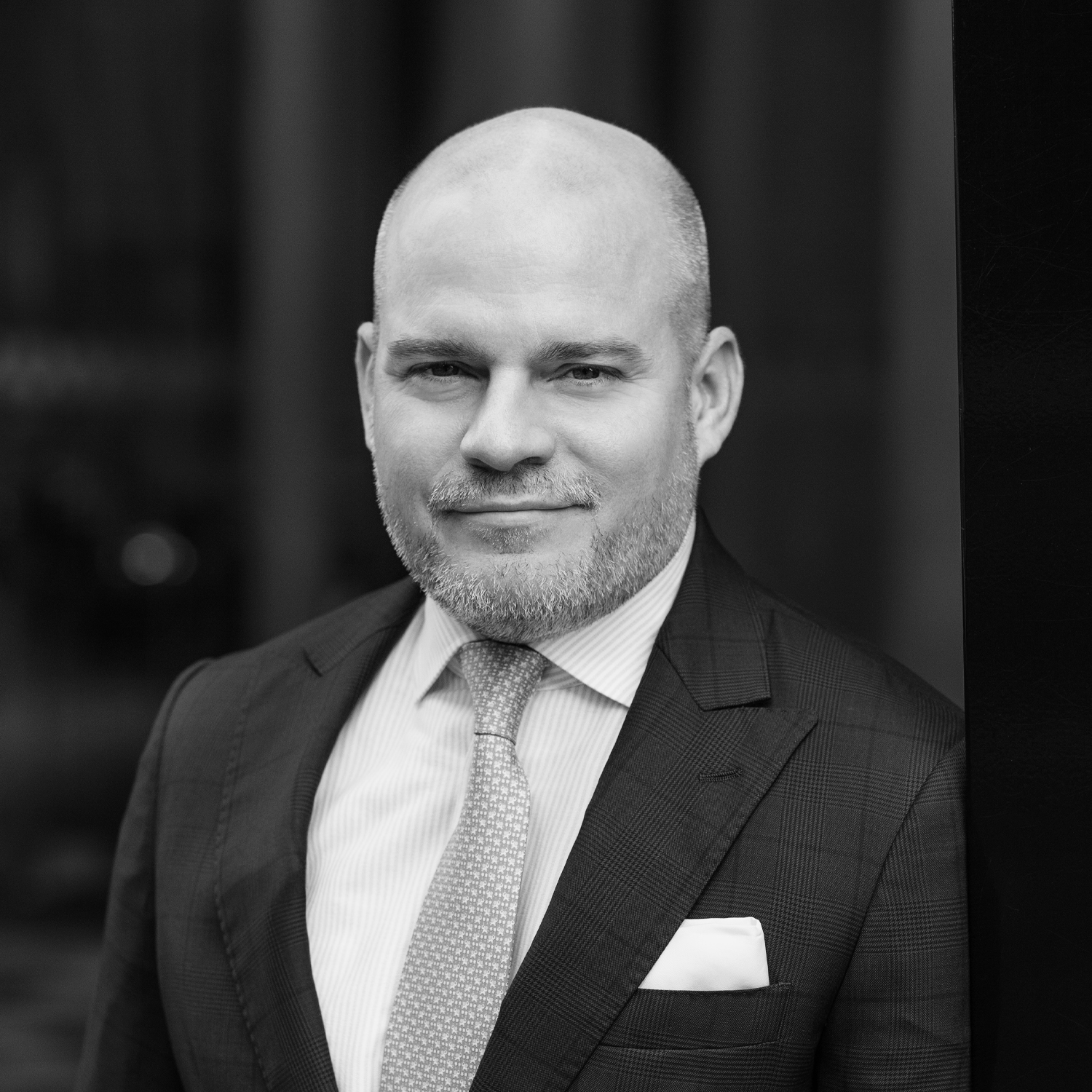 Black and white formal headshot of Roman Eggler.