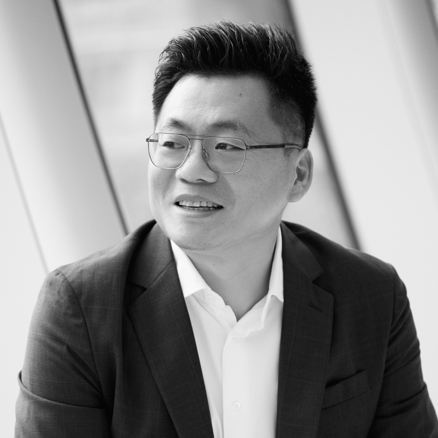 Black and white formal headshot of Randy Zhu.